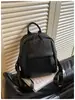 Venta al por mayor transfronteriza de mochilas casuales de gran capacidad para mujer, con diseños nuevos, sencillos y retro, adecuadas para viajar y como mochila para estudiantes