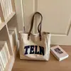 Bolsa de lona con bordado de letras para mujer, nuevo estilo 2026, gran capacidad, bolso de hombro moderno, versátil para ir al trabajo y para el uso diario