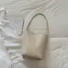 Bolsa de mão casual moderna com textura vintage de alta qualidade, nova 2026, bolsa versátil de ombro único, sob o braço, trançada
