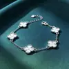 Pulsera de Trébol de Cuatro Hojas Moda Suministro en Vivo Pulsera Calidoscopio Plata Láser Simple Joyería de Mano de Gama Alta Lujo Ligero Venta al por Mayor