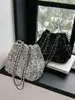 Bolso de diseñador de nicho transfronterizo para mujer, nuevo modelo 2026, bolso de hombro cruzado de cadena de alta gama, bolso tipo cubo con lentejuelas estilo coreano