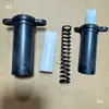 Peças de máquinas têxteis Peças de retorcedeira Peças de grande bobina Dongxing Lilai Suporte limitador Assento da mola Mola de tubo branco