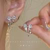 Pendientes de lazo rosa súper hada delicados y dulces, diseño de nicho, primavera y verano, sensación avanzada, sin agujeros para las orejas, espiral antimosquitos, clip para las orejas