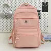 Mochila Escolar Grande Capacidade Estudante 2025 Novo Estilo Simples Tecido de Nylon Repelente à Água Mochila Casual de Viagem Mochila Feminina
