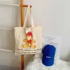 Inventario mayorista de comercio exterior último modelo grupo de suministro en vivo compra grupal ~ bolsa de lona de oso lindo de dibujos animados bolsa de hombro