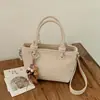 Bolso tipo cubo de tejido de alta gama para mujer, nuevo y elegante, estilo verano chic, de un solo hombro y cruzado