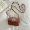 Bolso monedero mini de alto valor para mujer 2026 nuevo estilo bandolera sobre rojo de boca bolso de hombro con cadena de mariposa popular este año