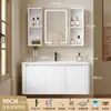 Tocador de baño engrosado y ahorrador de espacio con diseño en color crema, que cuenta con un lavabo redondeado, lavabo cerámico integrado y un lavabo de una sola pieza.