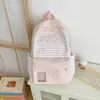 Mochila versátil estilo casual acadêmico, nova, de alta qualidade, listrada, estilo fresco japonês, para estudante do ensino fundamental, grande capacidade