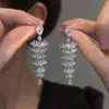 Aretes de Aguja Plateada con Borlas de Gota de Agua Incrustadas de Diamantes, Estilo Palacio, Nicho, Aretes Versátiles, Lujo Ligero, Venta al por Mayor de Aretes de Gama Alta