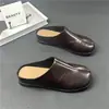 Mules planos de cuero genuino con puntera dividida para mujer, nuevo estilo primavera-verano 2026, sin cordones, versátiles, cómodos, negros