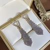 Corea del Sur Dongdaemun Aguja de plata S925 micro incrustada circonita aretes de lazo estilo TikTok mismo estilo femenino temperamento versátil estilo lujo ligero