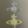 Diseño Moderno Europeo y Americano Broche de Saturno con Pedrería en Forma de Cruz Pin de Ropa para Traje de Moda Broche de Saturno para Mujer