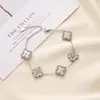 Colar de Trevo de Quatro Folhas com Patch Laser Ins Europeu e Americano Pulseira Dupla Face Feminina Brinco Versátil Conjunto de Brincos Acessível Luxo Fabricante Atacado