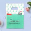 Bolsa de plástico para tienda de ropa, venta al por mayor, con estampado de dibujos animados de flores, cuatro dedos, portátil, para compras, regalo