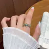 Anillo de blogger mismo estilo café dorado y turquesa azul para mujer, diseño abierto con diamantes, nicho de lujo ligero, anillo para dedo índice de alta gama y elegante
