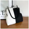 Bolso de mano de gamuza con diseño de nicho para comercio exterior para mujer, nuevo bolso retro con clip para teléfono, bolso de hombro cruzado versátil, moderno