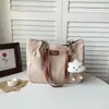 Bolsa feminina 2026 outono nova estilo coreano bolsa escolar estudantil simples moda bolsa de ombro grande capacidade bolsa tote para o dia a dia