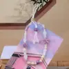 Jingdezhen Cerámica Dulce Estrella de Mar Vieira Moda Cadena para Teléfono Móvil Cuerda Colgante para Bolso de Cámara Nuevo para Mujer Venta al por Mayor
