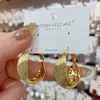 Pendientes Trenzados de Metal Atmosférico de Alta Gama para Mujer, Elegantes Europeos y Americanos, Lujo Accesible, Pendientes Populares de Aguja Plateada, Pendientes para el Trabajo