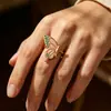 Nuevo anillo abierto de mariposa con goteo de aceite transfronterizo, moderno y versátil anillo de flor de acero inoxidable chapado en oro de 18 quilates para mujer