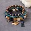 Produto popular de travessia de fronteira europeu e americano: Pulseira com pingente de coração estilo boho, pulseira de contas com cordão elástico multicamadas