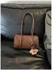 Bolso rojo para mujer 2026 nuevo de moda de verano de alta gama vintage para el trabajo bandolera moderno versátil bolso de axila