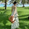 Vestido de tirantes floral suave estilo francés para mujer, verano, vacaciones en la playa, cola con volantes de alta gama, vestido largo