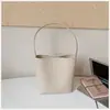 Bolsa de balde com padrão trançado de nicho Shuai Mi Jia para mulheres, novo modelo de verão 2026, bolsa de ombro simples, casual, para o dia a dia, estilosa
