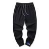 Pantalones de seda de hielo con cordón en los tobillos para hombre, verano, delgados, versión coreana de talla grande, pantalones casuales, tendencia de moda, venta al por mayor, pantalones de nueve puntos
