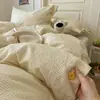 2026 Nuevo Juego de Ropa de Cama de Algodón Lavado Juego de Cuatro Piezas Raya Botón Hogar Dormitorio Juego de Cuatro Piezas Lavable a Máquina Todas las Estaciones Universal