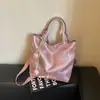Bolso de mujer suave y liso de alta calidad, nuevo modelo 2026, bolso tote de gran capacidad para el trabajo diario, bolso de hombro versátil para comercio exterior