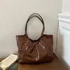 Bolso de Mano Retro Brillante Transfronterizo para Mujer Otoño/Invierno 2026 Nuevo Versátil Gran Capacidad para el Trabajo con un Solo Hombro Debajo del Brazo
