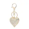 Llavero de corazón de diamantes completos coreano aleación de zinc amantes amor llavero de coche de aleación de zinc strass colgante para bolso de mujer venta al por mayor