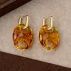 Novos Brincos Dourados de Alta Definição Resina Âmbar Brincos Nariz de Porco Retrô Elegantes Modernos Brincos de Luxo Atacado