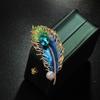 Broche de pluma de esmalte de estilo retro goteo de aceite de la Edad Media, personalidad femenina, accesorios para abrigo de traje, pin de joyería transfronterizo