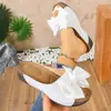 Sandalias de cuña de una tira de comercio exterior europeo y americano, sandalias de suela gruesa con lazo de talla grande para mujer, sandalias de color liso de moda transfronterizas