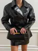 Conjunto de Cuero Brillante Estilo Retro, Modelo Nuevo Transfronterizo Europeo y Americano 2026, Chaqueta de Cuero de Doble Botonadura Ceñida a la Cintura con Minifalda de Cuero del Mismo Color