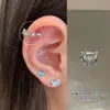 Anillo de hueso de la oreja de flor hueca clavo de oreja de acero de titanio cierre de rosca borde clavo de hueso de la oreja anillo de hueso de la oreja personalidad temperamento versátil