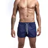 Nuevos pantalones de fitness de verano transfronterizos europeos y americanos para hombre, cómodos, transpirables, de color sólido, para correr, deportes de ocio y entrenamiento.