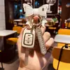 Ajuste de Imagem Aplicável Conjunto de Chaves Feminino Prancha Reta Estilo Feng Antigo Jing Rui Bin Zhi xrv Bolsa para Controle Remoto de Carro Concha com Fivela Ge Rui