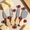 Juego de cuatro piezas de cuchillo para queso de acero inoxidable con mango de madera, cuchillo para queso, tenedor para pastel de cocina, cuchillo para crema, herramienta de cuchillo para mantequilla de pizza