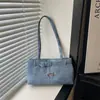 Tendencia de moda coreana para desplazamientos 2026 nuevo bolso de hombro simple con hebilla de cinturón diseño retro moderno bolso de axila