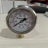 Manómetro YN60 resistente a golpes G 1/4 cabeza de manómetro radial llena de glicerina y aceite de silicona, rosca estándar británica, salida de 1/4 de pulgada, manómetro transfronterizo