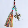 Colgante para coche en el mismo estilo que los borlas de cinco colores del Tíbet, cuerda colgante de campana del dios de la riqueza de cinco vías, recuerdo de atracción turística de Yunnan