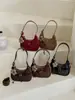 Bolso de hombro nuevo con patrón tejido para mujer, bolso cruzado retro coreano, bolso de axila con diseño de nicho, bolso moderno y versátil
