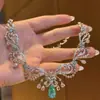 Colar verde deslumbrante inspirado na floresta com diamantes totais nicho luxo leve design requintado de alta qualidade moderno versátil corrente para clavícula de banquete