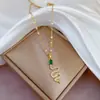 [Acero de Titanio] Lujo Ligero Serpiente de Ojos Verdes Microincrustada Cadena de Clavícula para Mujer con Cuentas de Transferencia Celebridad de Ins Cyber Accesorios