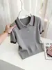 Camisa polo de venta caliente con bloques de color y rayas tejidas para mujer, nueva moda primavera-verano 2026, top de manga corta ajustado
