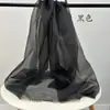Precio por metro tela de organza de perla brillante y luz intermitente malla dura para estilismo malla para ropa de boda